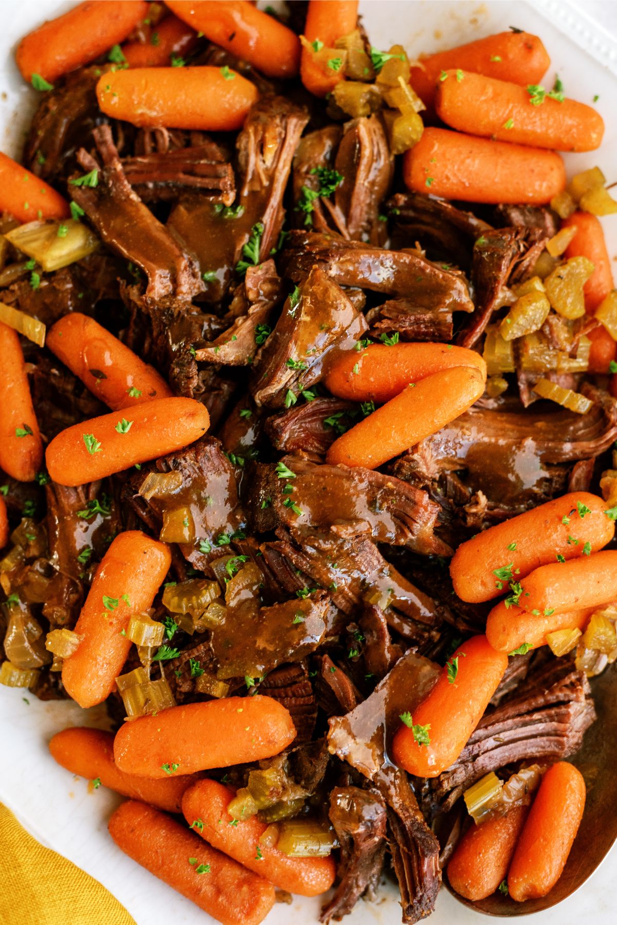 Close up of shredded Slow Cooker Balsamic Pot Roast on a serving plate