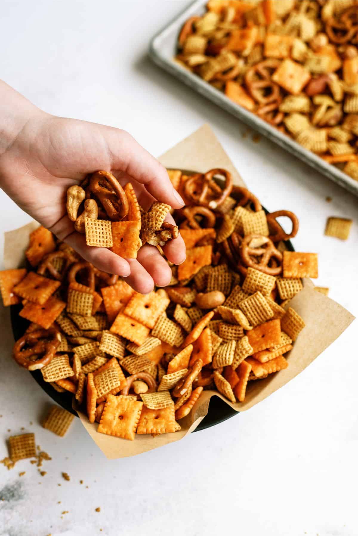 A handful of Slow Cooker Savory Chex Mix