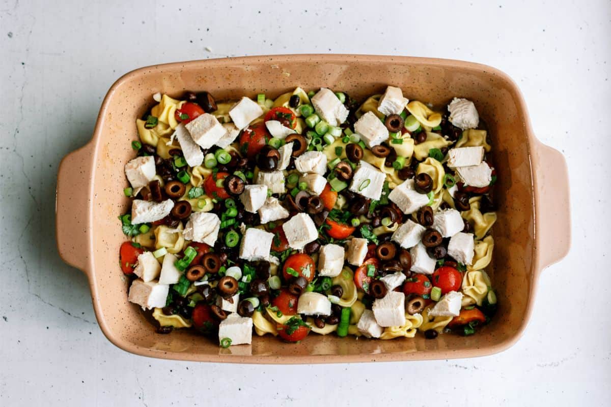 Toppings, turkey and tortellini in casserole dish