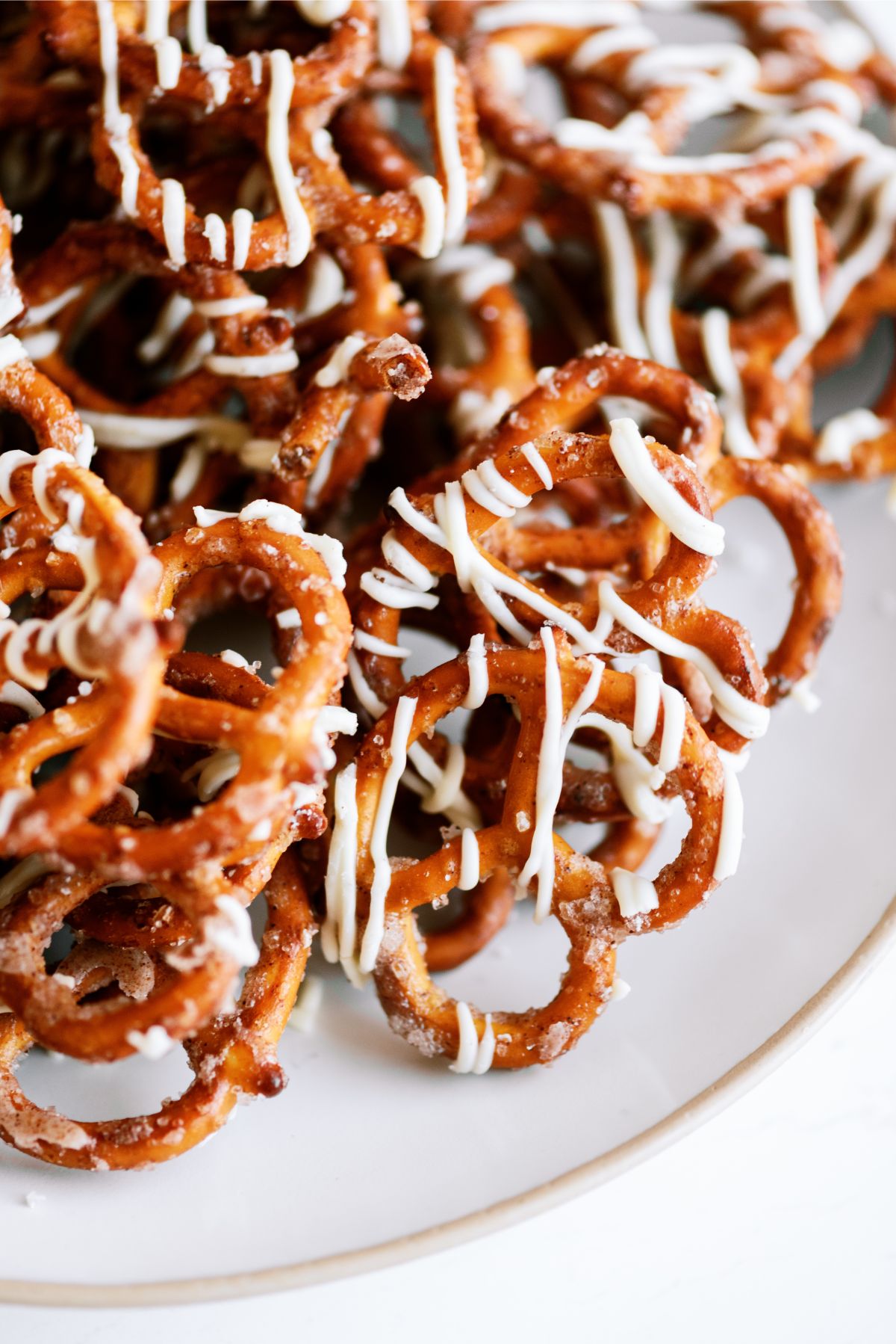 Close up of White Chocolate Cinnamon Sugar Pretzels on a plate