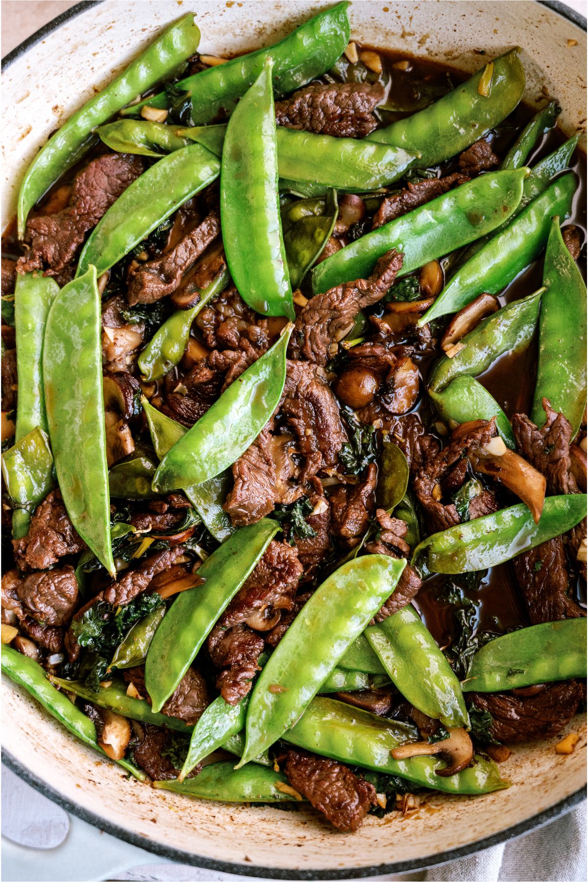 Asian Beef and Snow Peas in a skillet