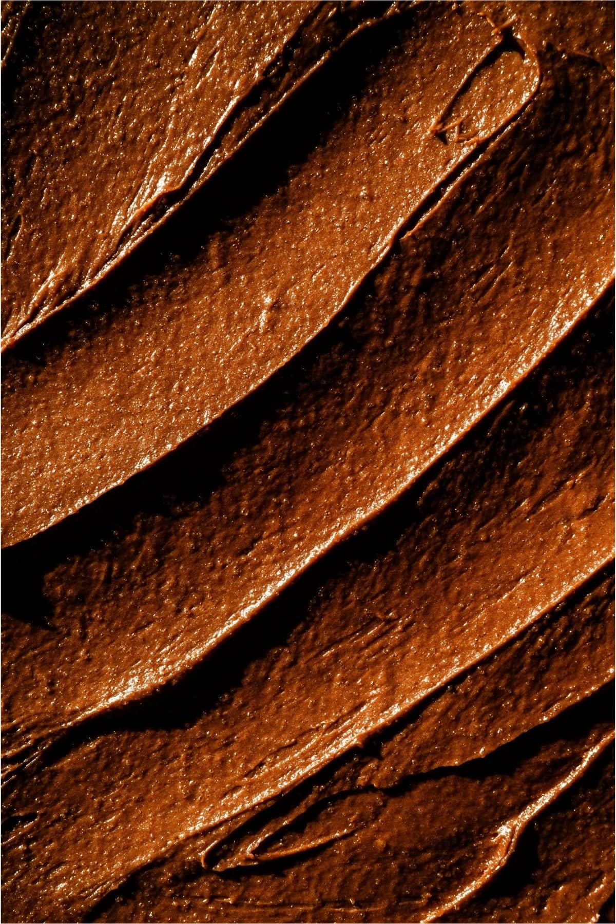 Chocolate frosting spread on top of mint frosting.