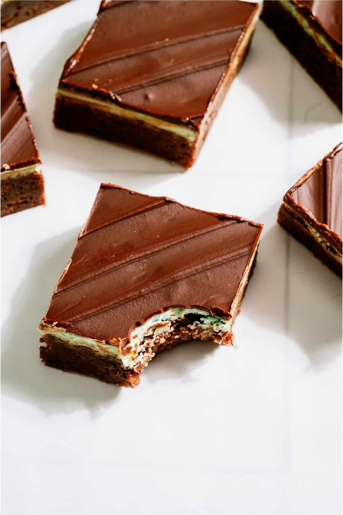 A bite missing out of a Chocolate Thin Mint Brownie.