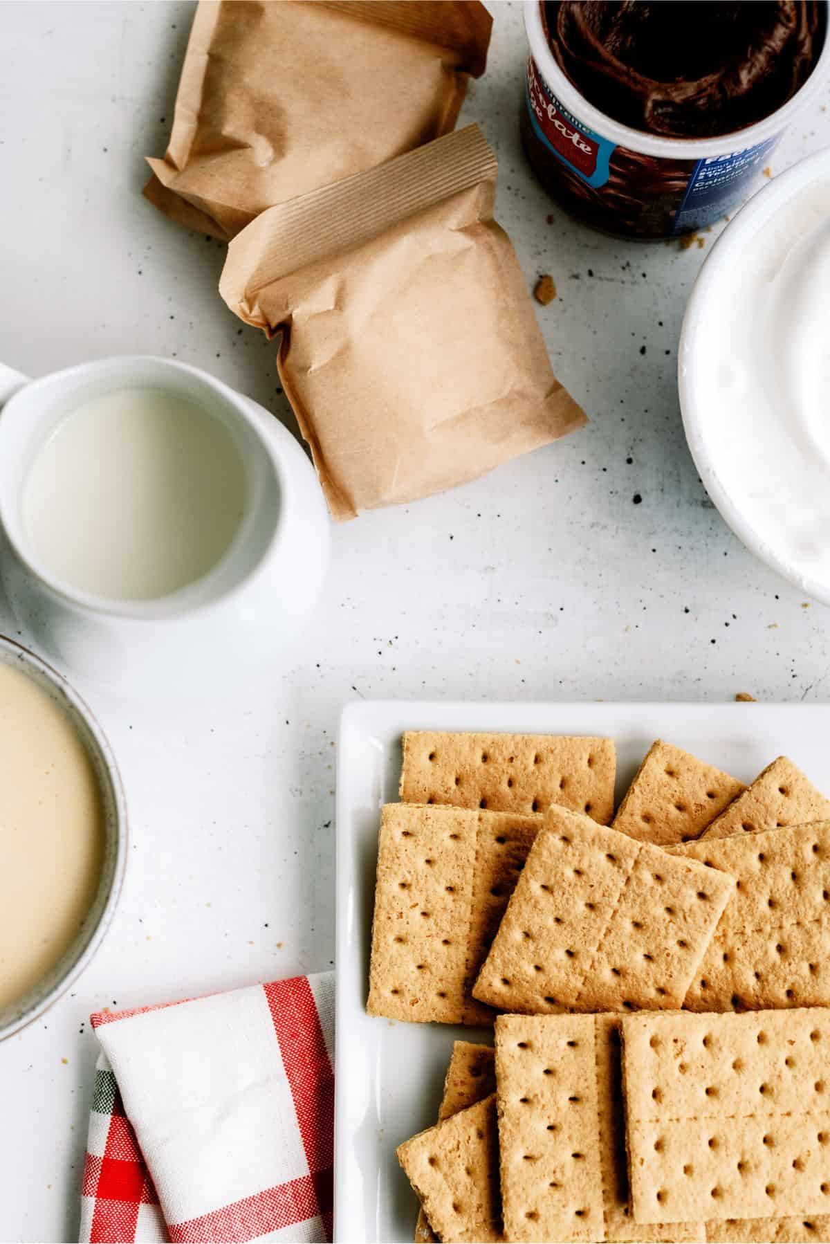 Ingredients needed to make Eggnog Eclair Cake.
