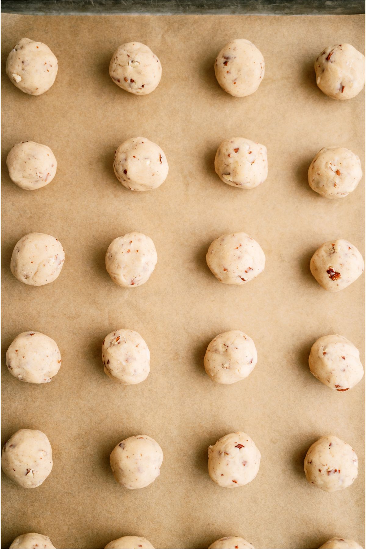 Unbaked Mexican Wedding Cookies on baking sheet