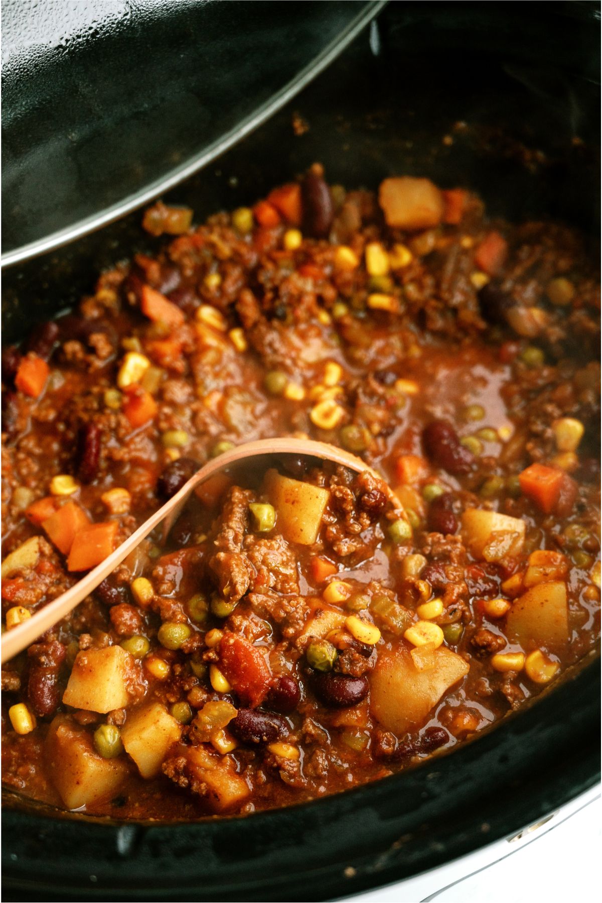 Shepherd's Pie Chili in the slow cooker with a ladle
