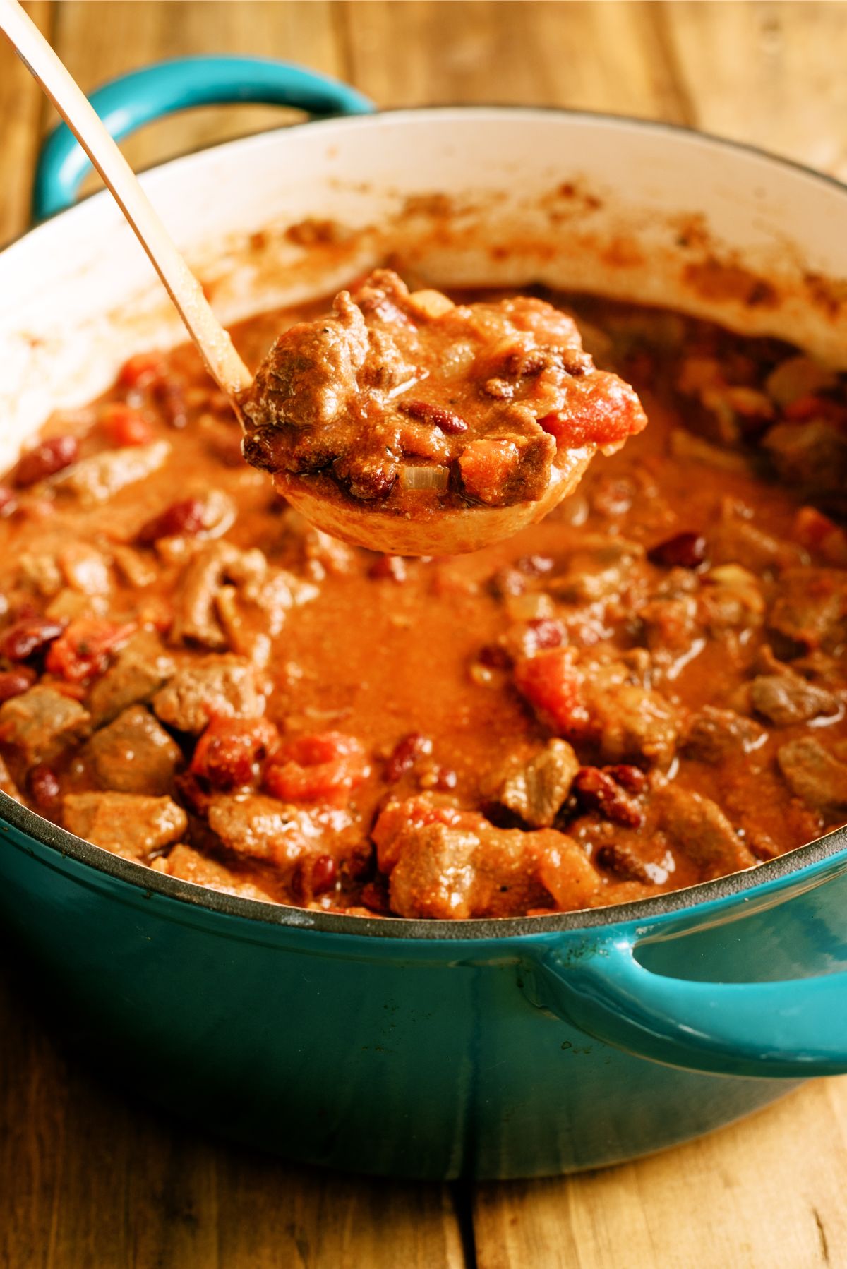 Large pot with a ladle full of Texas Roadhouse Copycat Chili