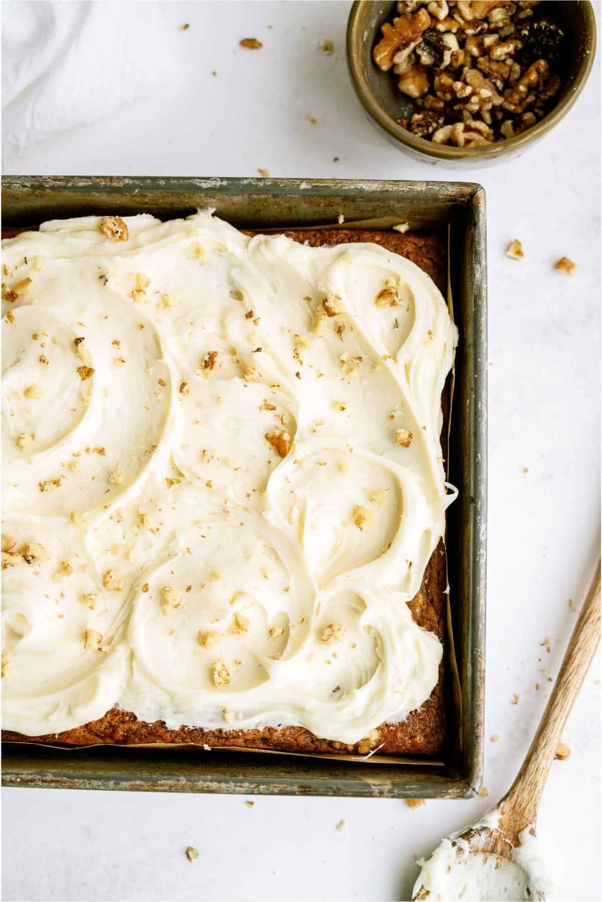 Banana Bread Brownies in pan topped with frosting