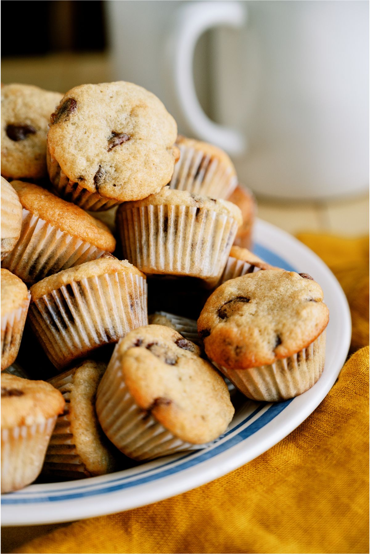 A plate stacked with Mini Banana Muffins