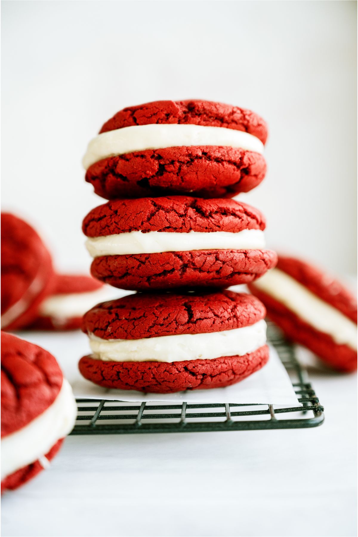 3 Red Velvet Whoopie Pie Sandwich Cookies stacked on top of each other