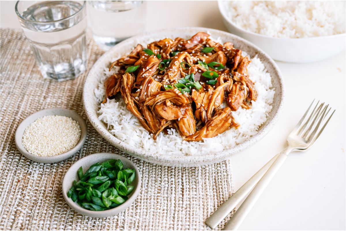 A plate of Slow Cooker Asian Glazed Chicken on top of  rice