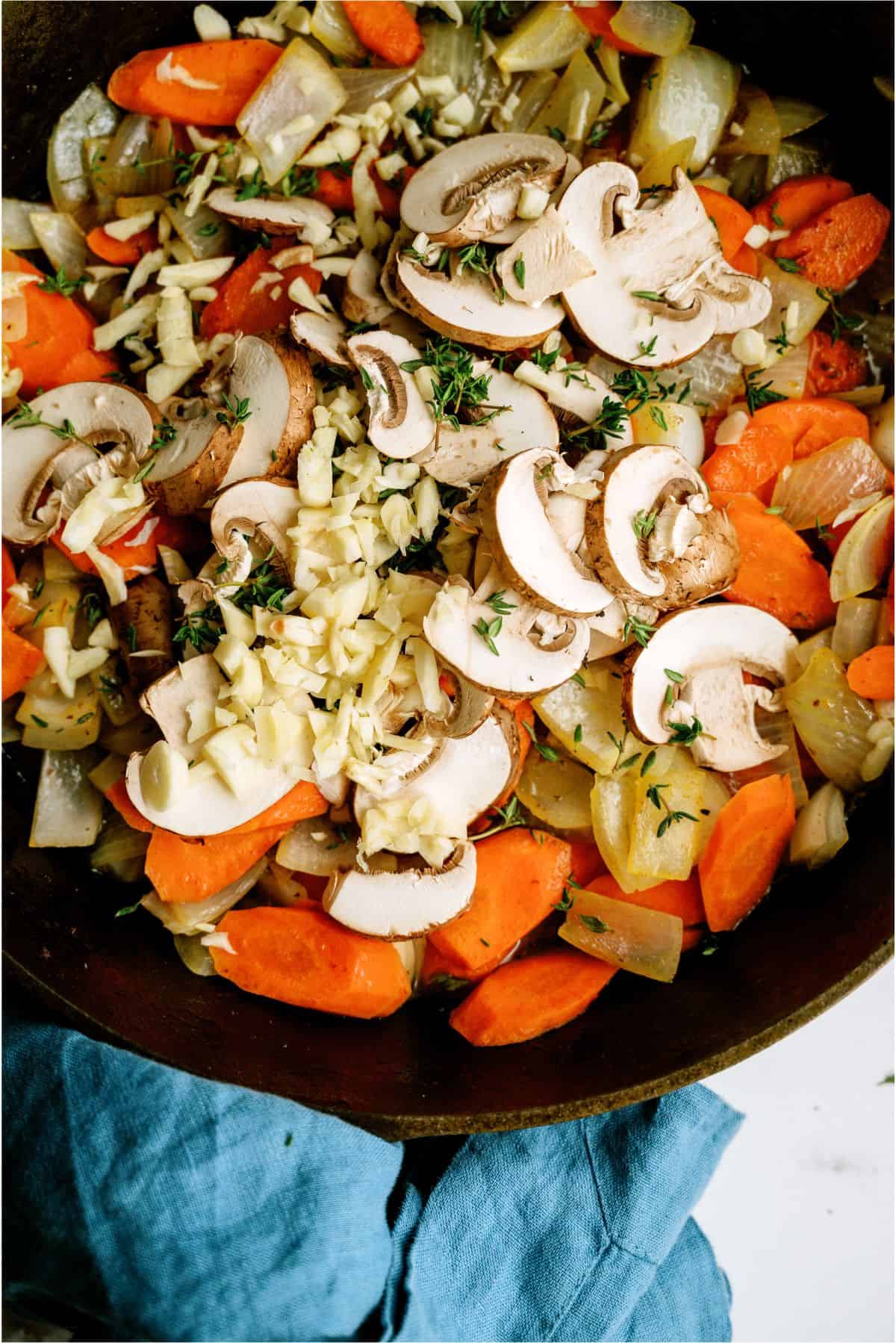 Sauteing veggies for Slow Cooker Beef Bourguignon in skillet