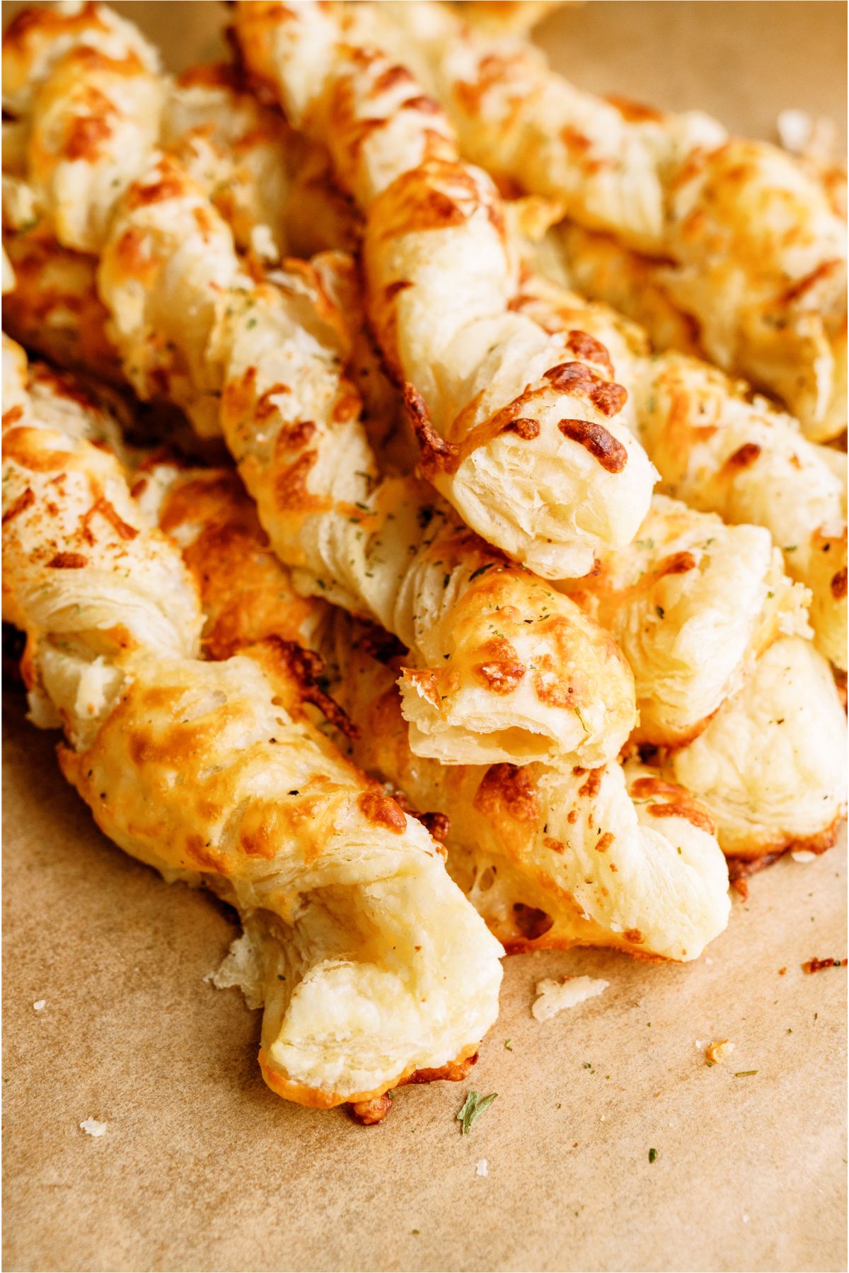Close up of Twisted Cheese Breadsticks in a pile