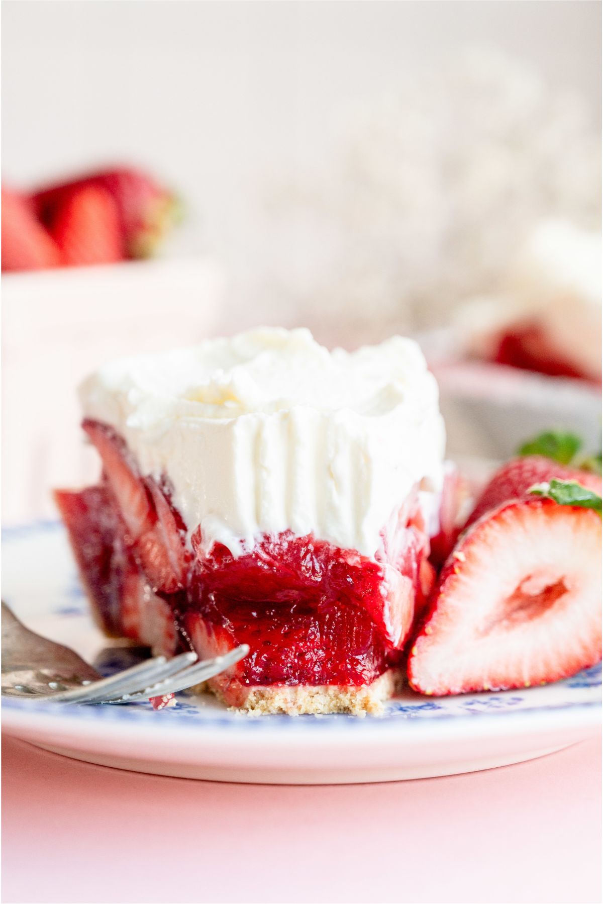 A slice of Fresh Strawberry PIe on a plate with a fork