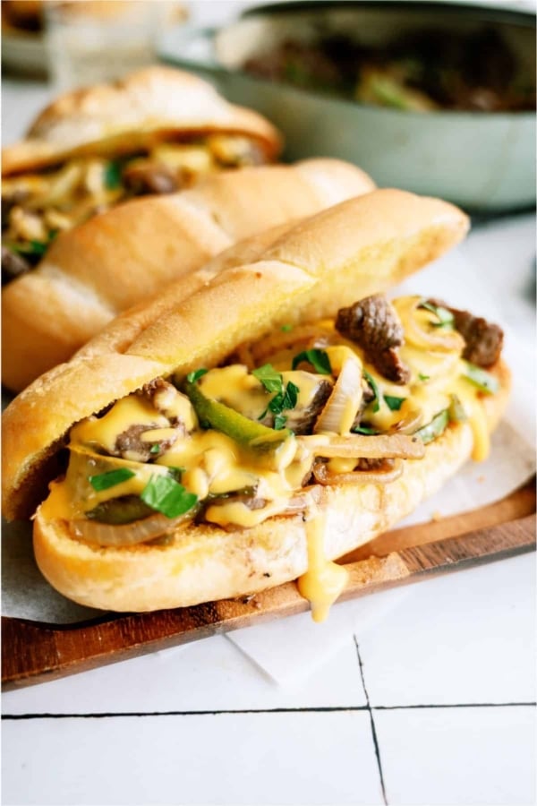Philly Cheesesteak Sandwich on a cutting board.