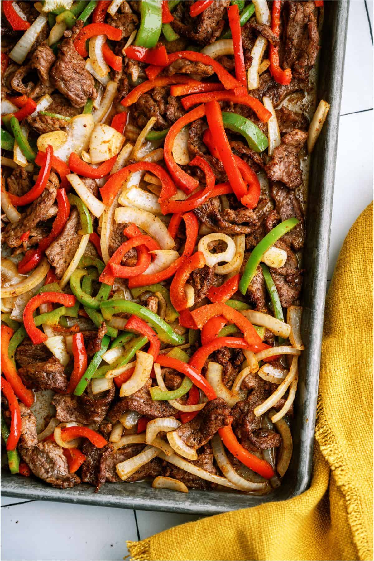 A pan of Sheet Pan Steak Fajita meat and veggies.