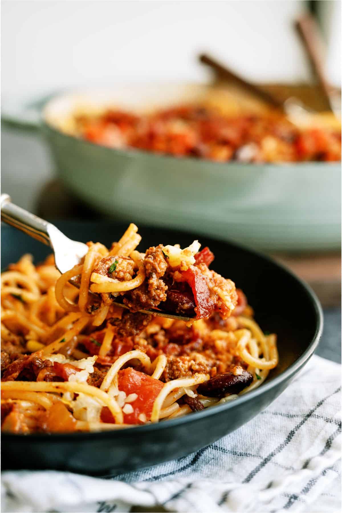 A plate of Skillet Cowboy Spaghetti with a fork