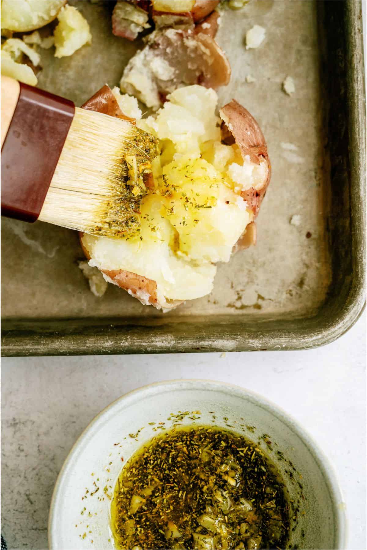 Smashed potatoes brushed with seasoning and oil