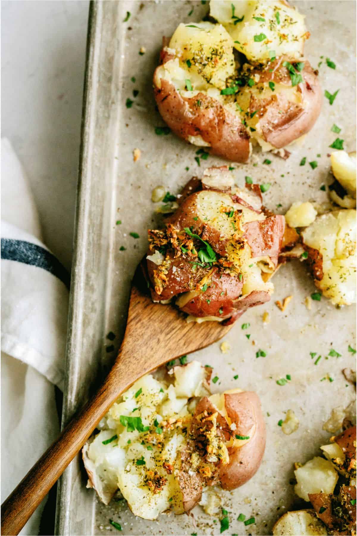 Top view of Smashed Italian Red Potatoes on baking sheet