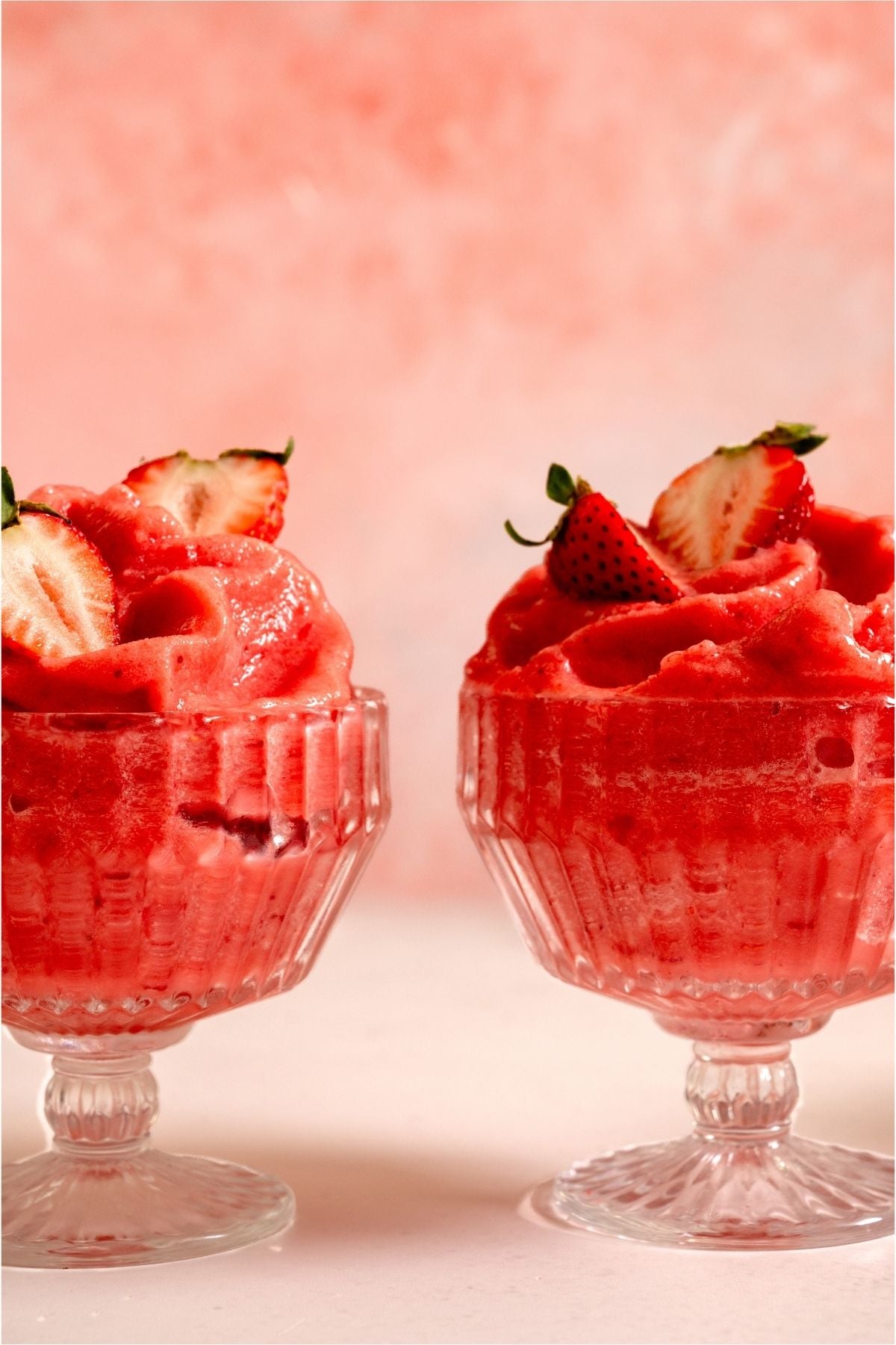 2 glasses of Strawberry Dole Whip.