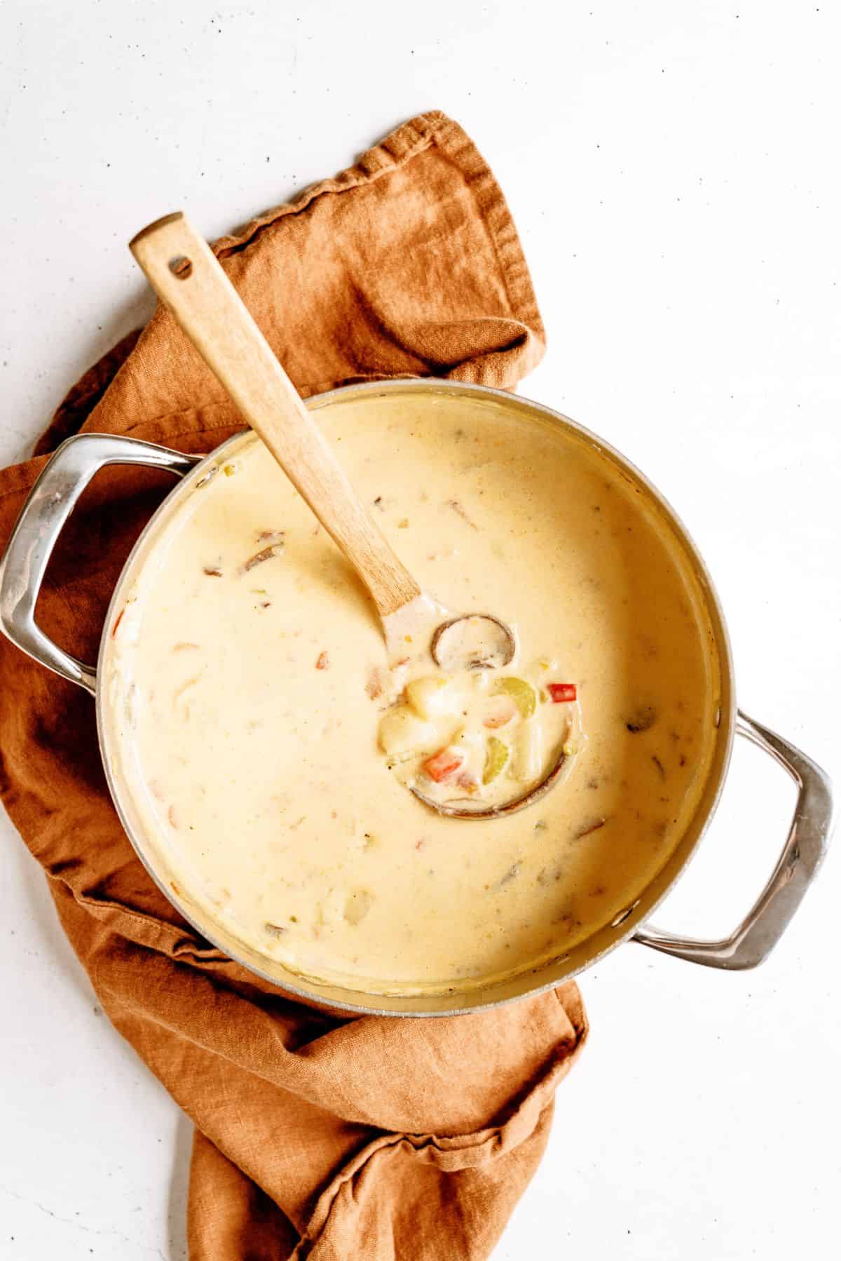 Top view of a pot of Wisconsin Bacon And Potato Cheese Soup