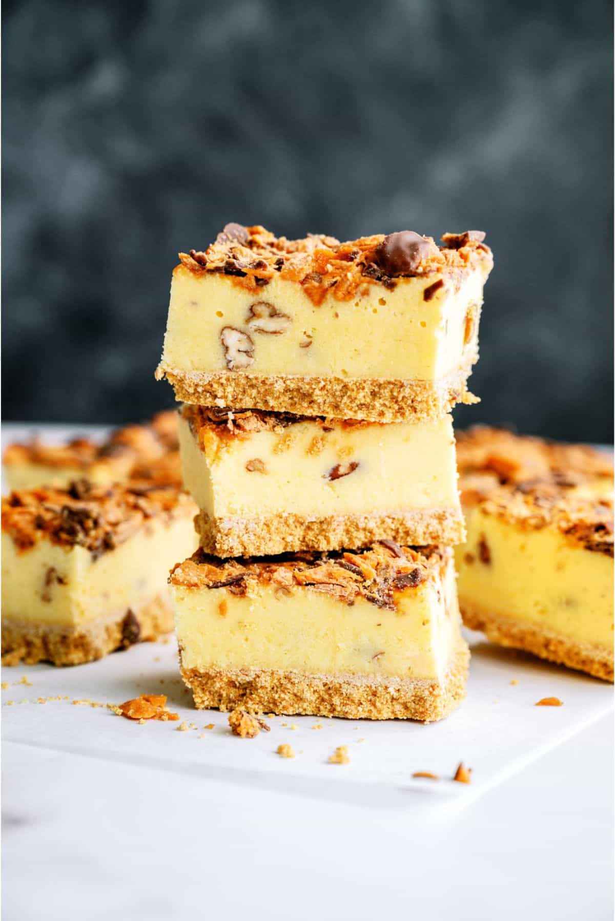 3 Butterfinger Ice Cream Bars stacked with others surrounding it.