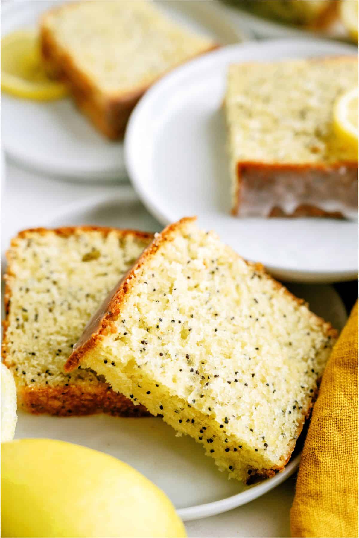 Slices of Glazed Almond Poppy Seed Bread on a plate