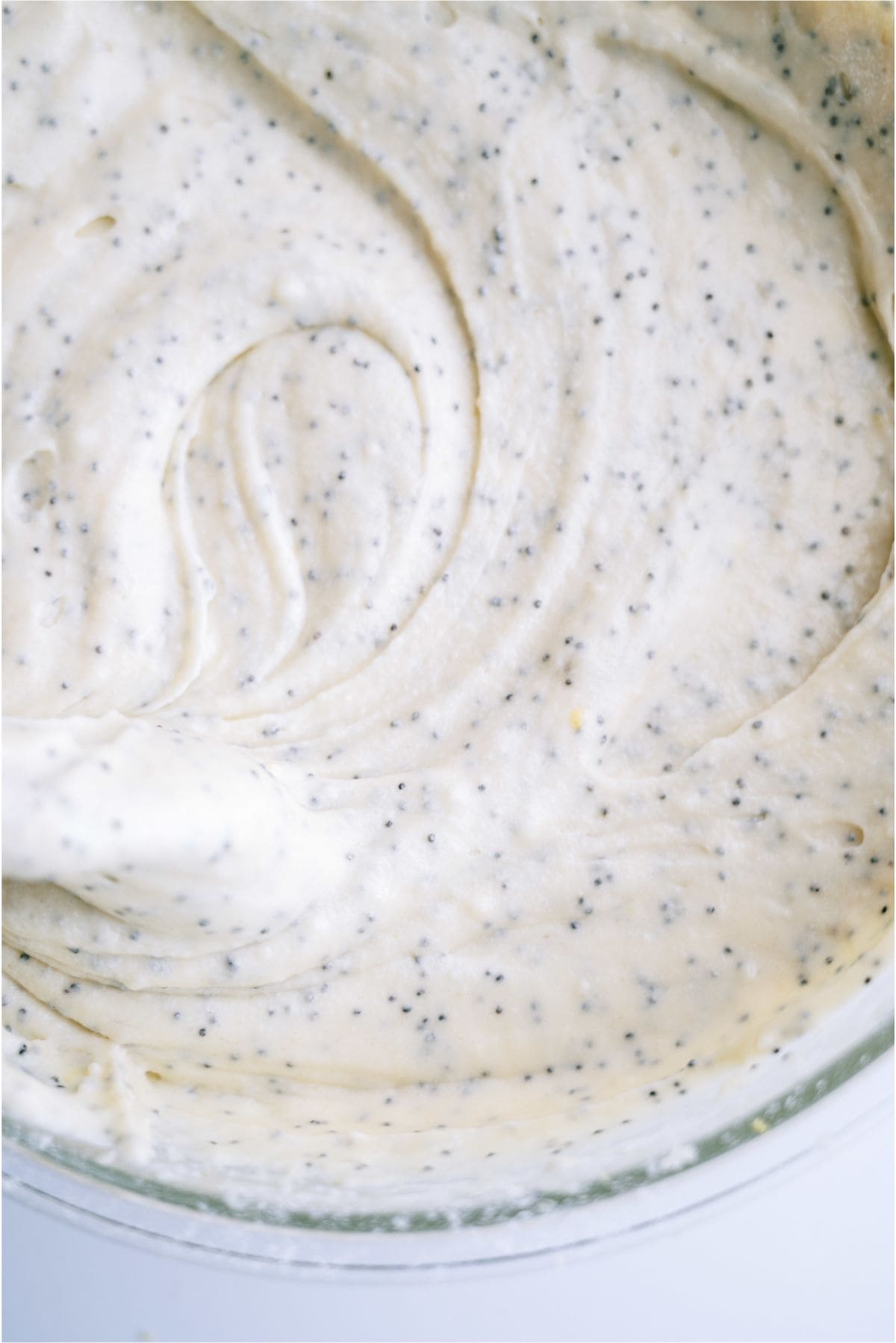 Glazed Almond Poppy Seed Bread batter in a mixing bowl