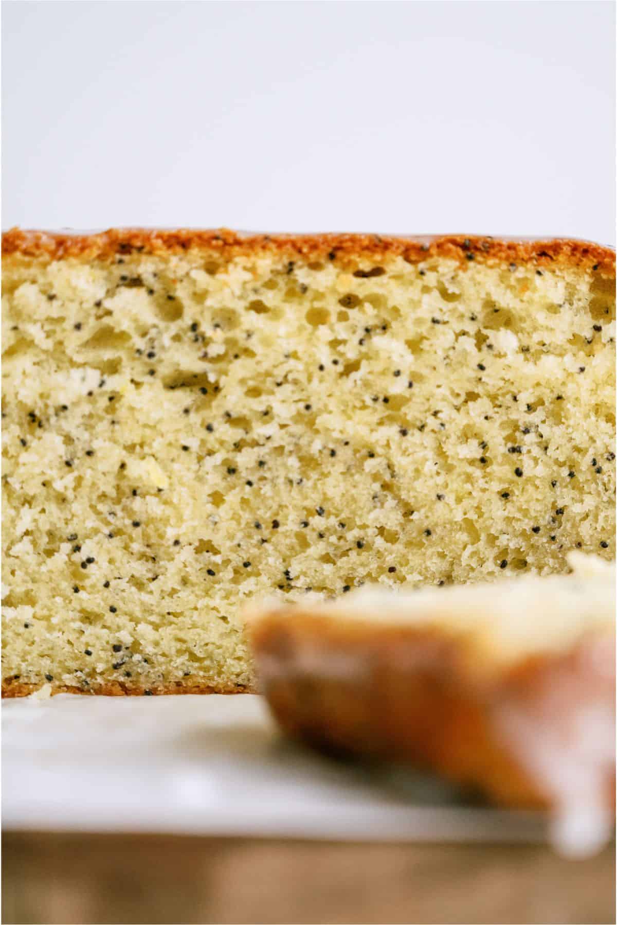 Loaf of Glazed Almond Poppy Seed Bread sliced