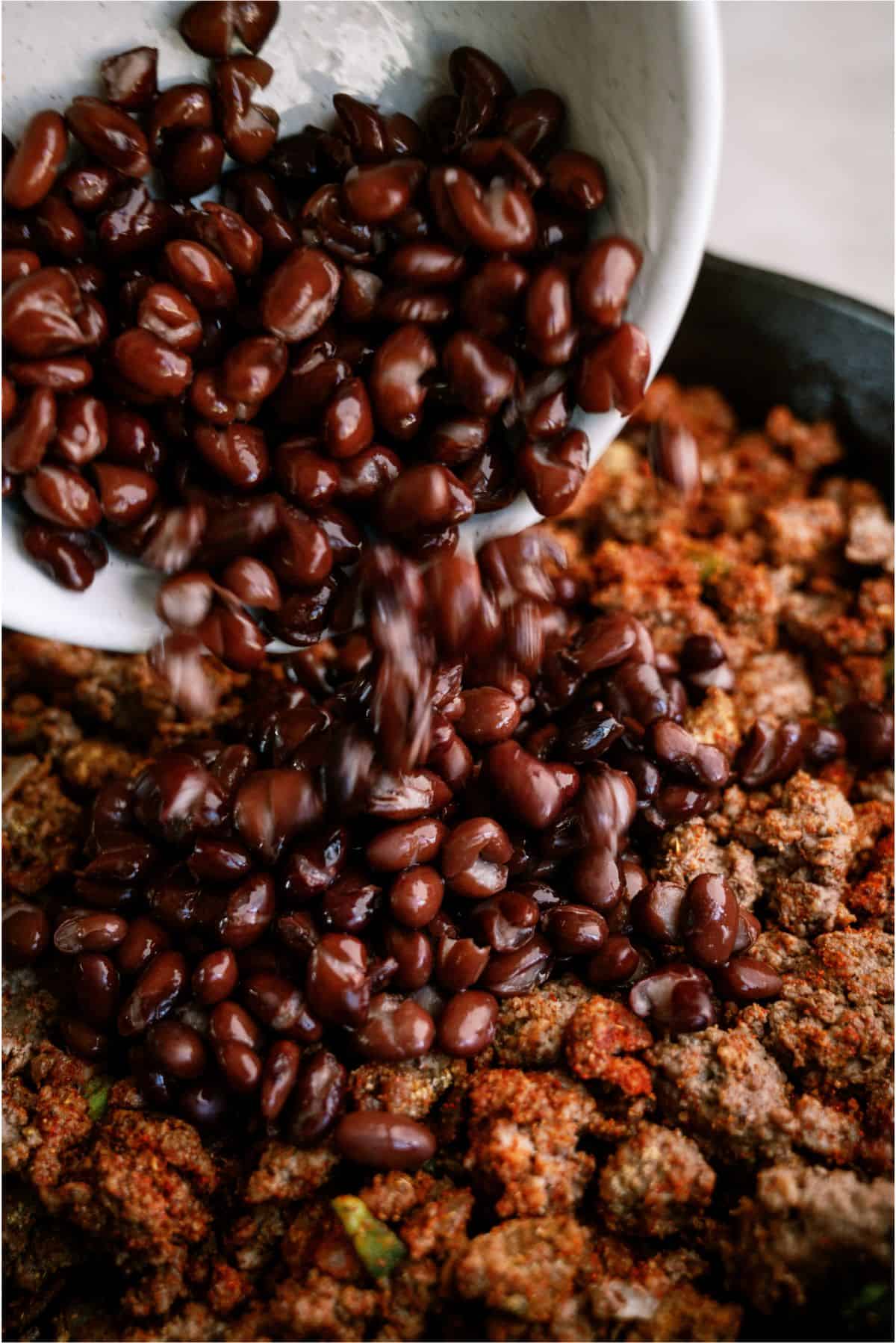 Adding black beans to ground beef skillet mixture