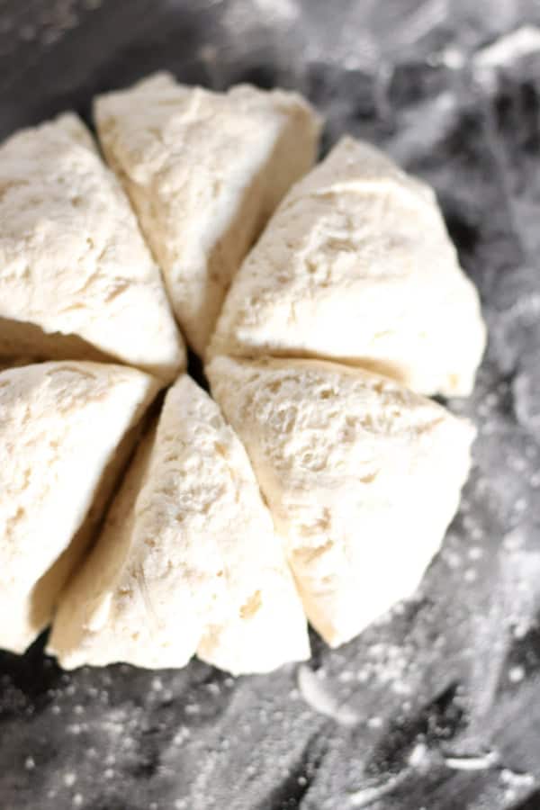 Easy Homemade Naan Bread dough cut into 6 sections.