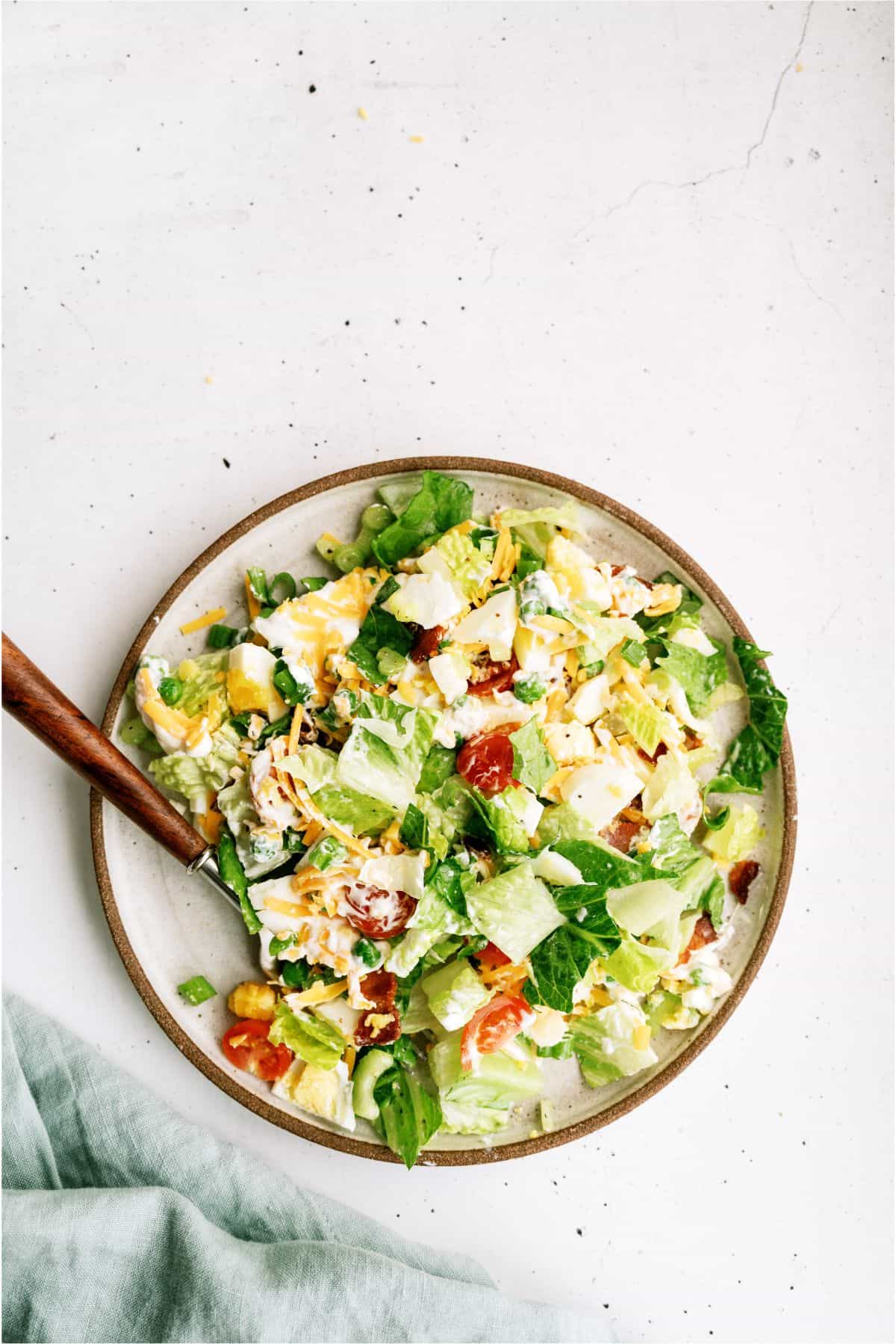 A serving of Seven Layer Green Salad on a plate