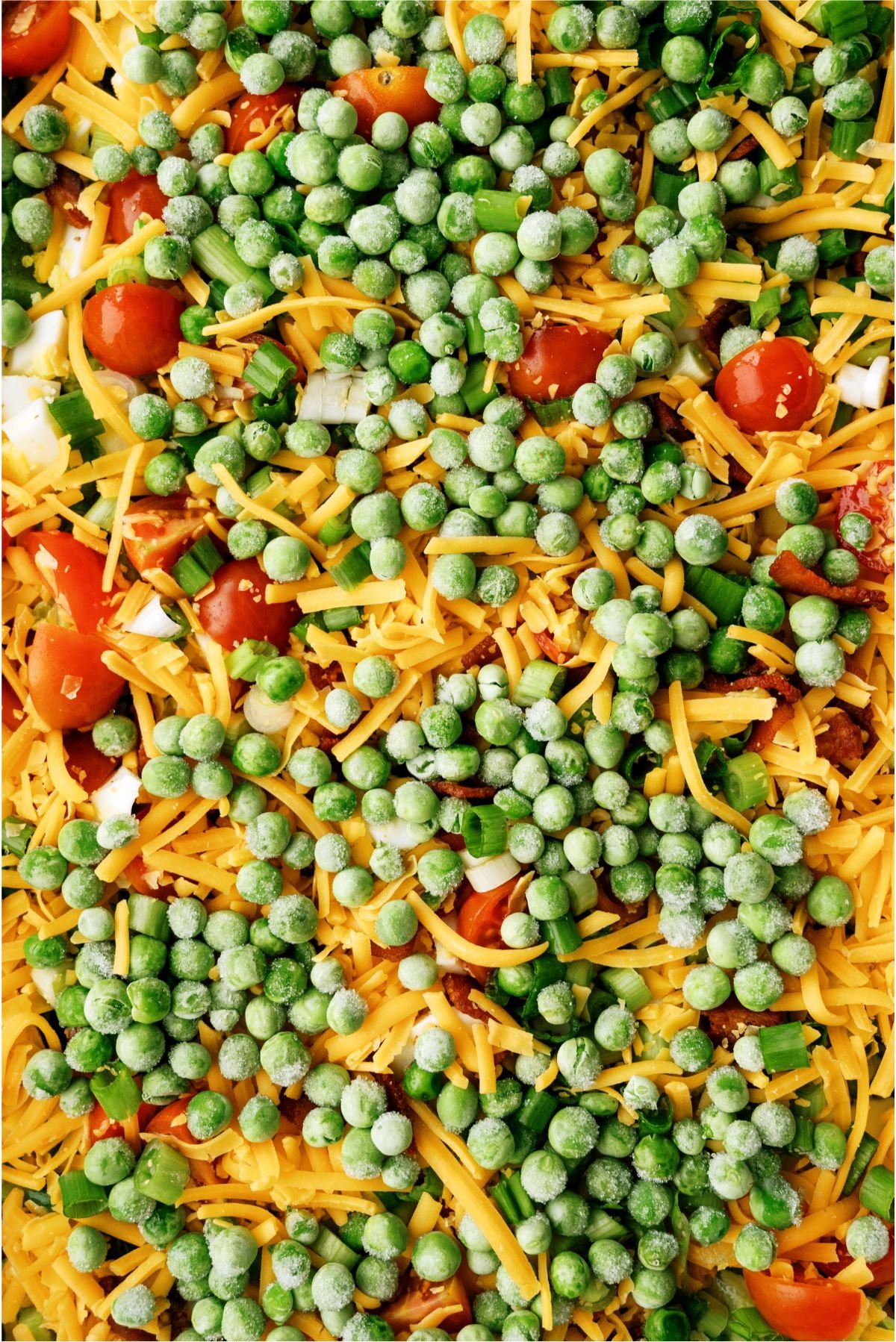Layer of frozen peas added on top