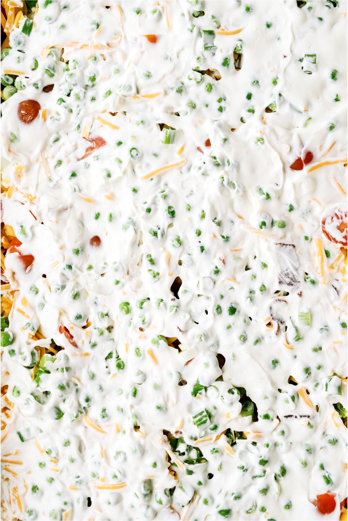Spread ranch dressing layer on top