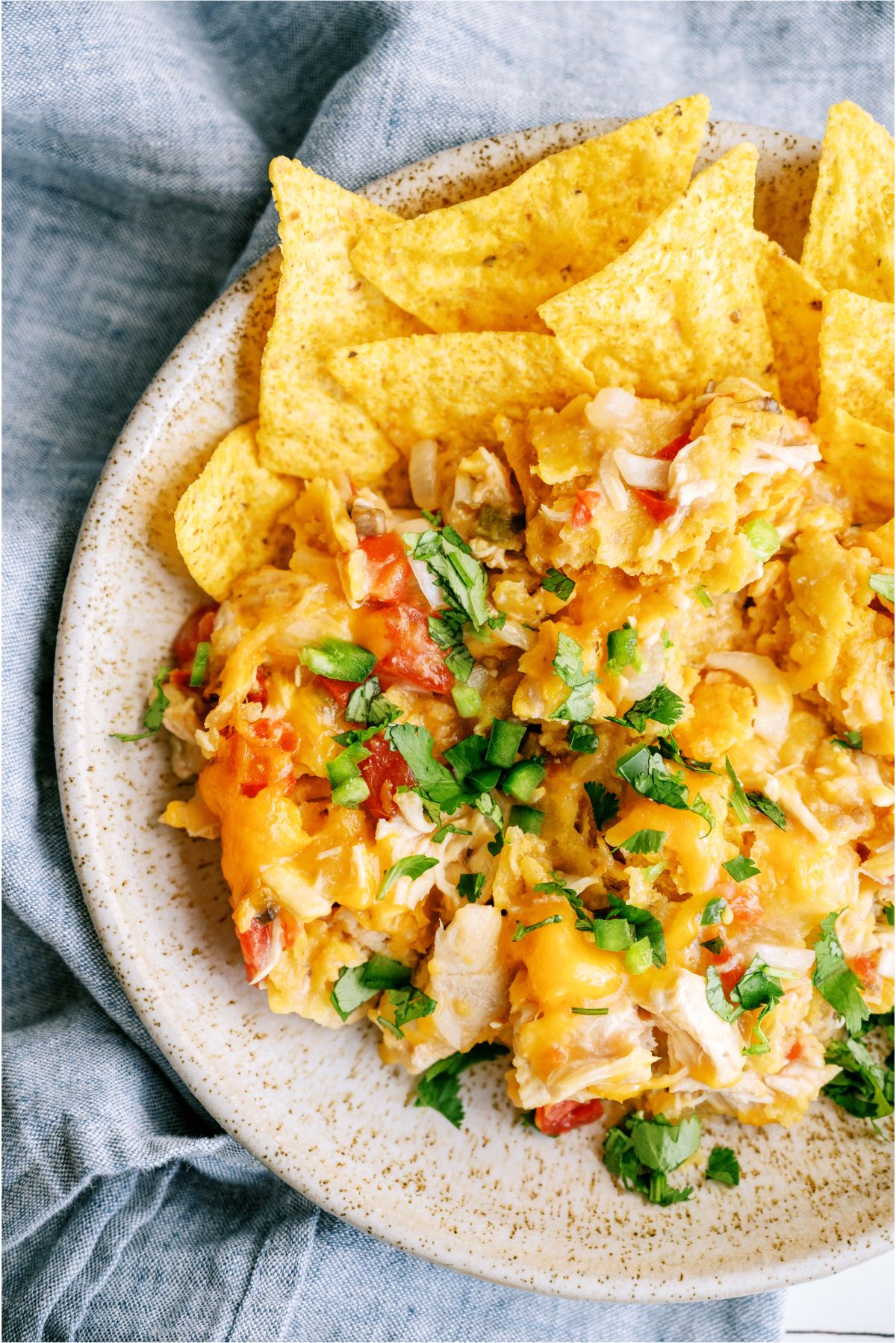 A plate of Slow Cooker King Ranch Chicken with extra tortilla chips