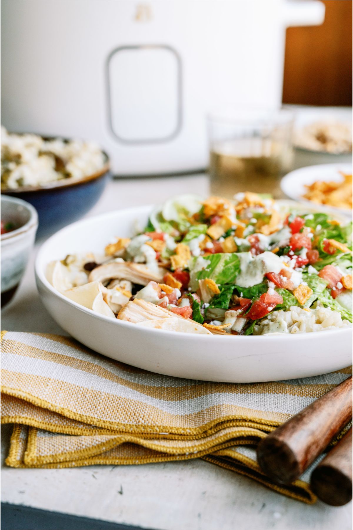 Cafe Rio Slow Cooker Chicken and Cilantro Rice in a bowl with toppings