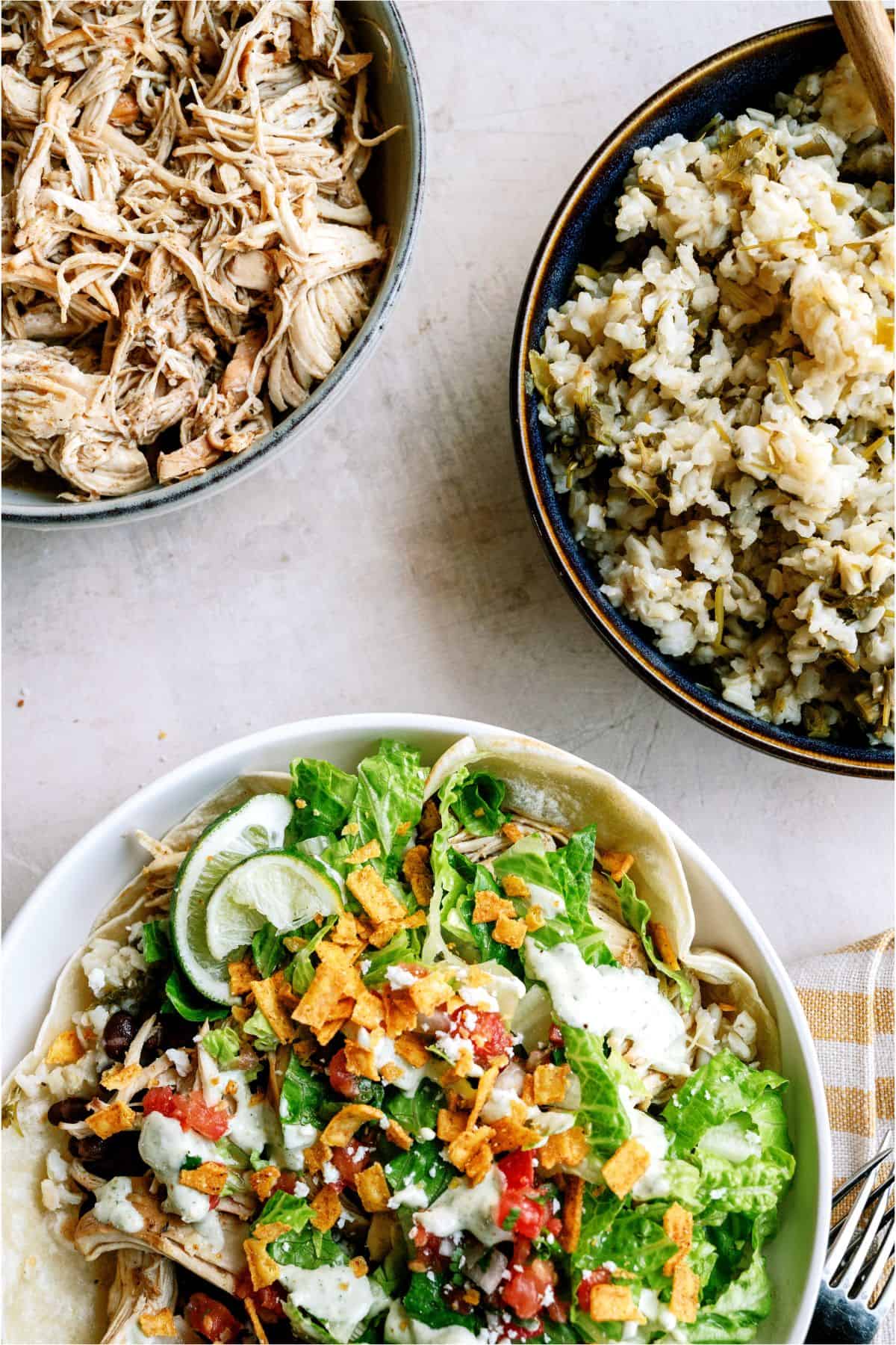 A bowl of Cafe Rio Slow Cooker Chicken and Cilantro Rice with a bowl of Cafe Rio Slow Cooker Chicken and a bowl of Cilantro Rice