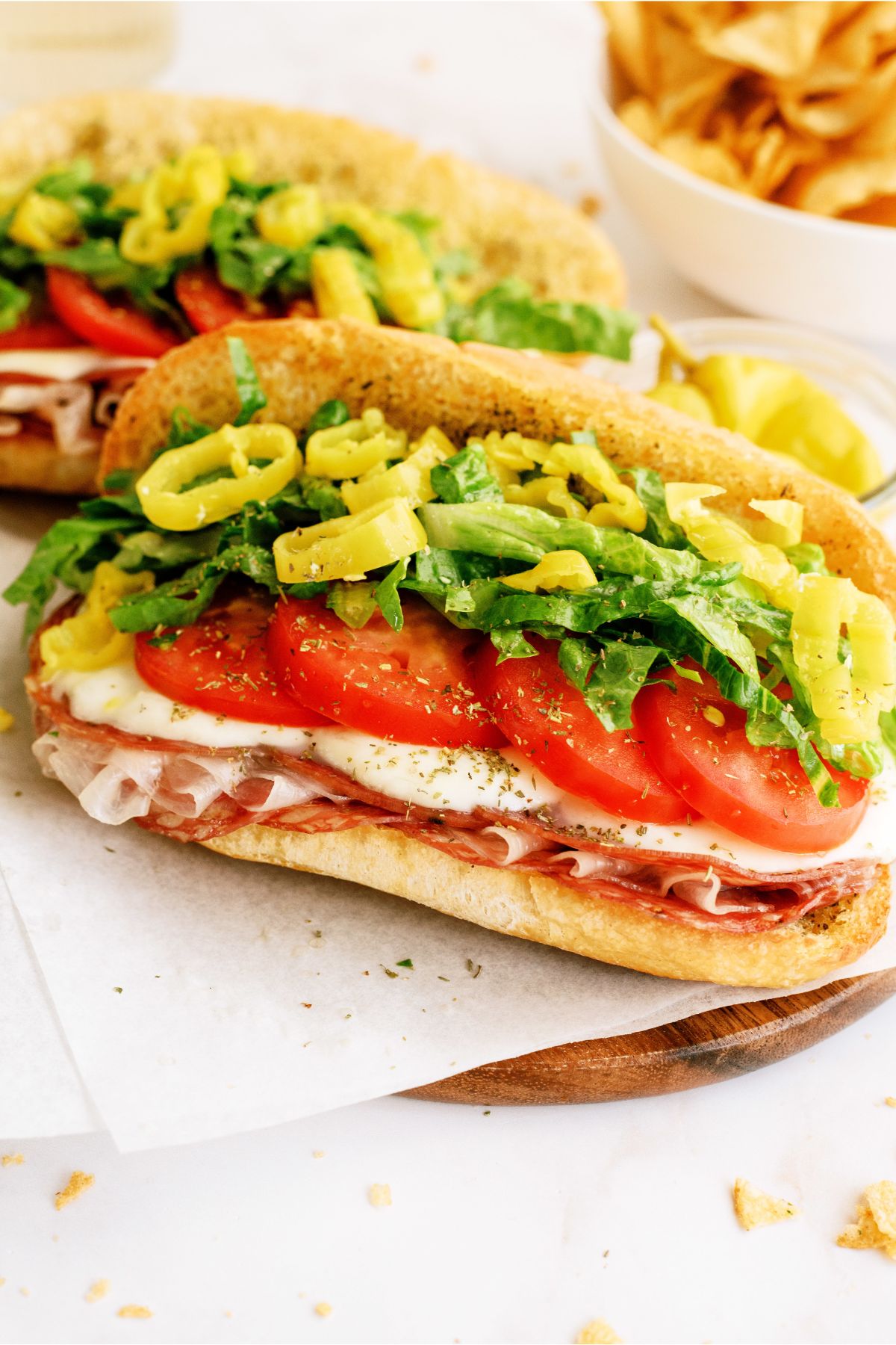 Two Hot Italian Trio Sandwiches with toppings