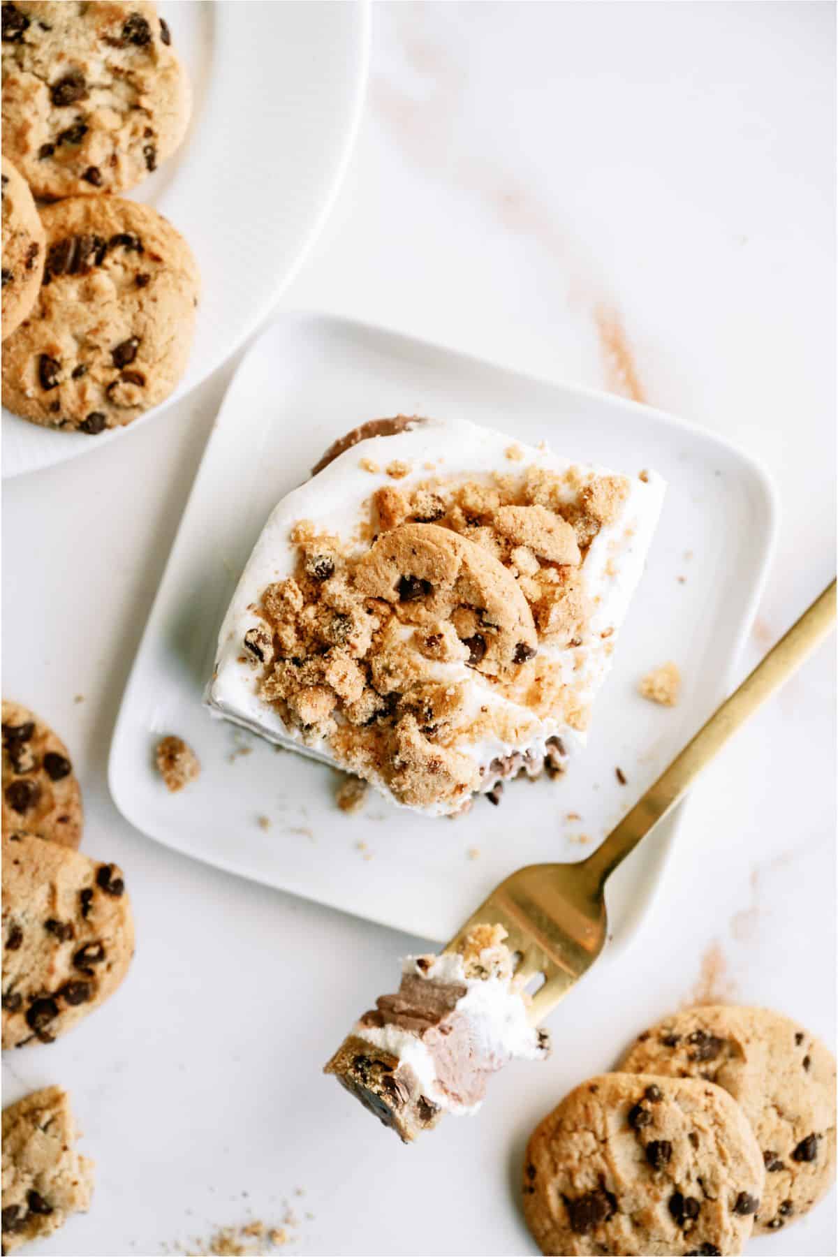 Top view of a slice of Layered Chocolate Chip Cookie Dessert on a plate