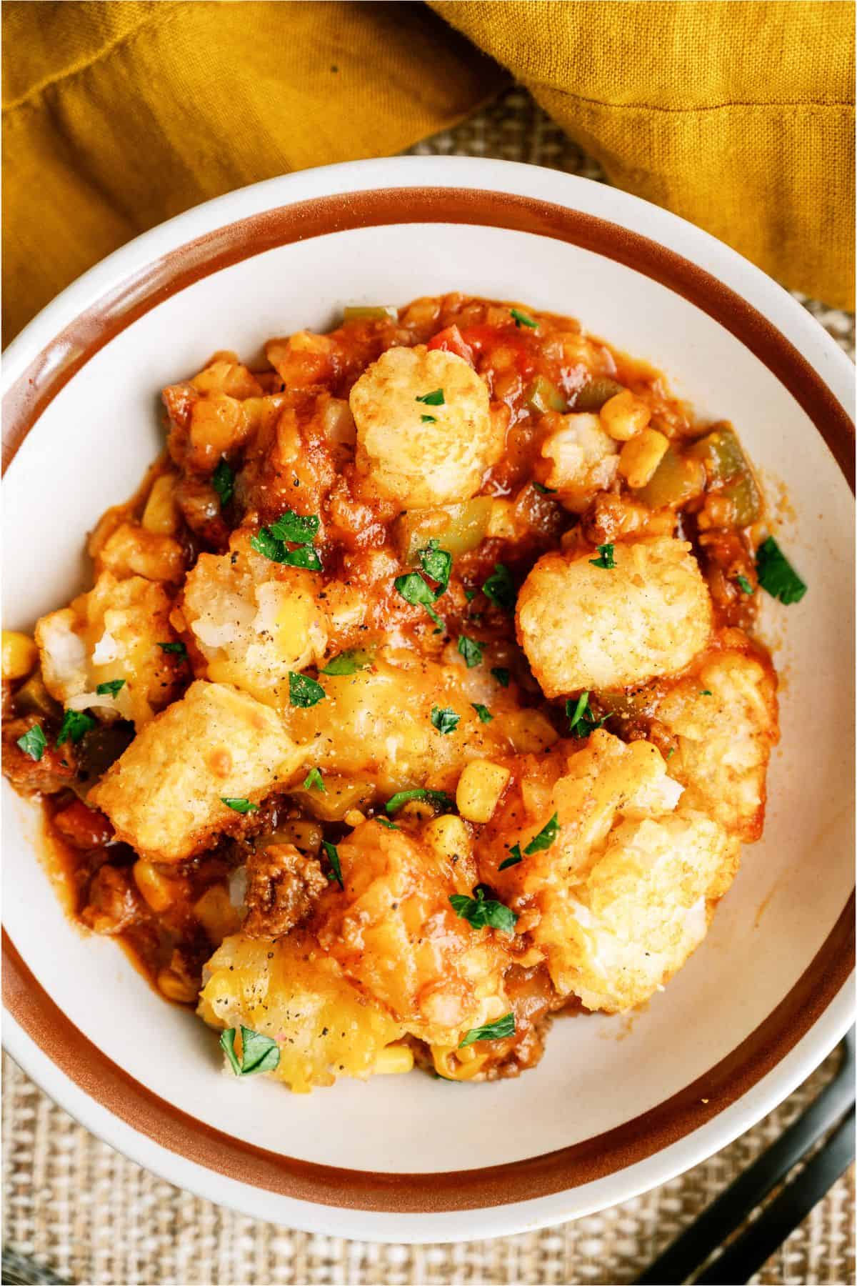 Close up of a serving of BBQ Tater Tot Casserole in a bowl