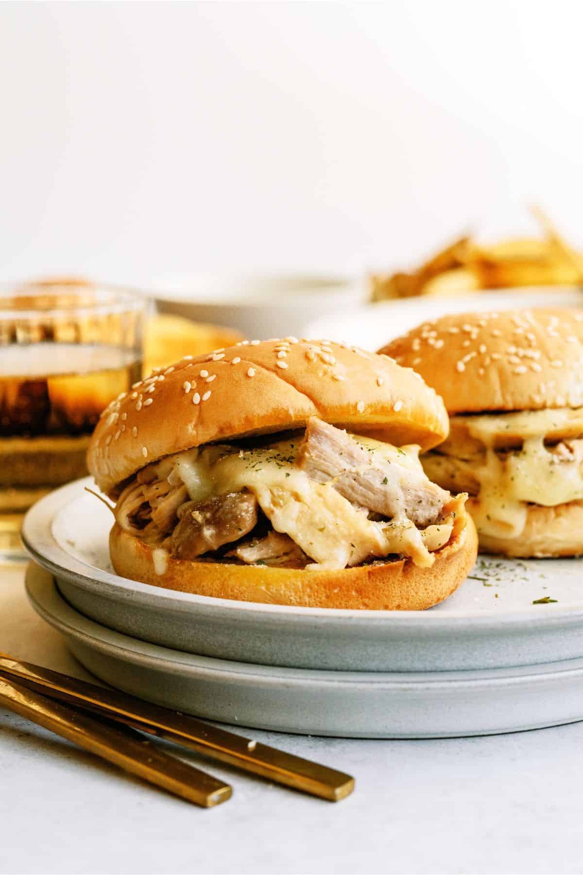 Two Instant Pot Ranch Chicken and Swiss Sandwiches on a platter