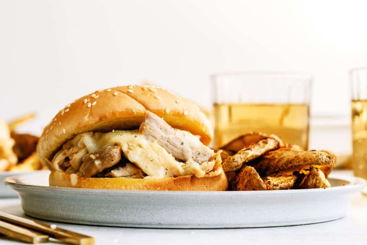 Instant Pot Ranch Chicken and Swiss Sandwich on a plate with fries