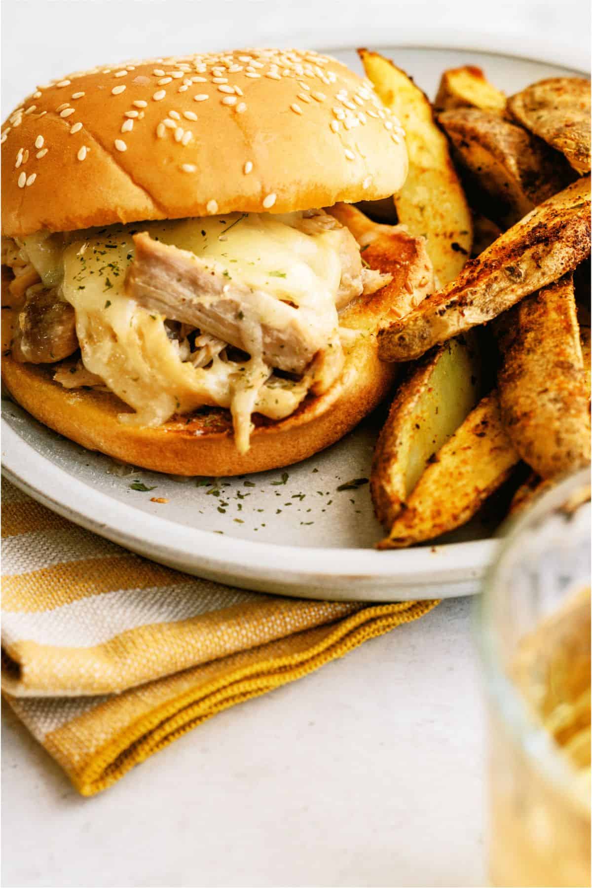 Instant Pot Ranch Chicken and Swiss Sandwich on a plate with fries