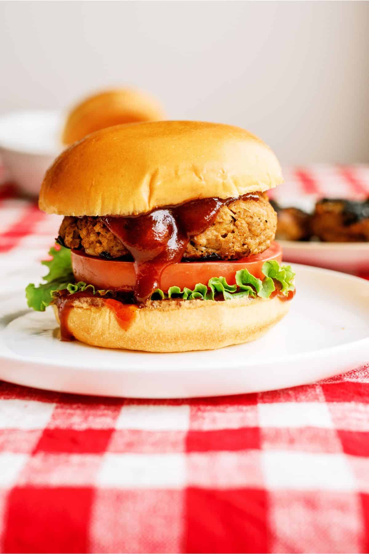 Juicy BBQ Turkey Burger with toppings on a plate