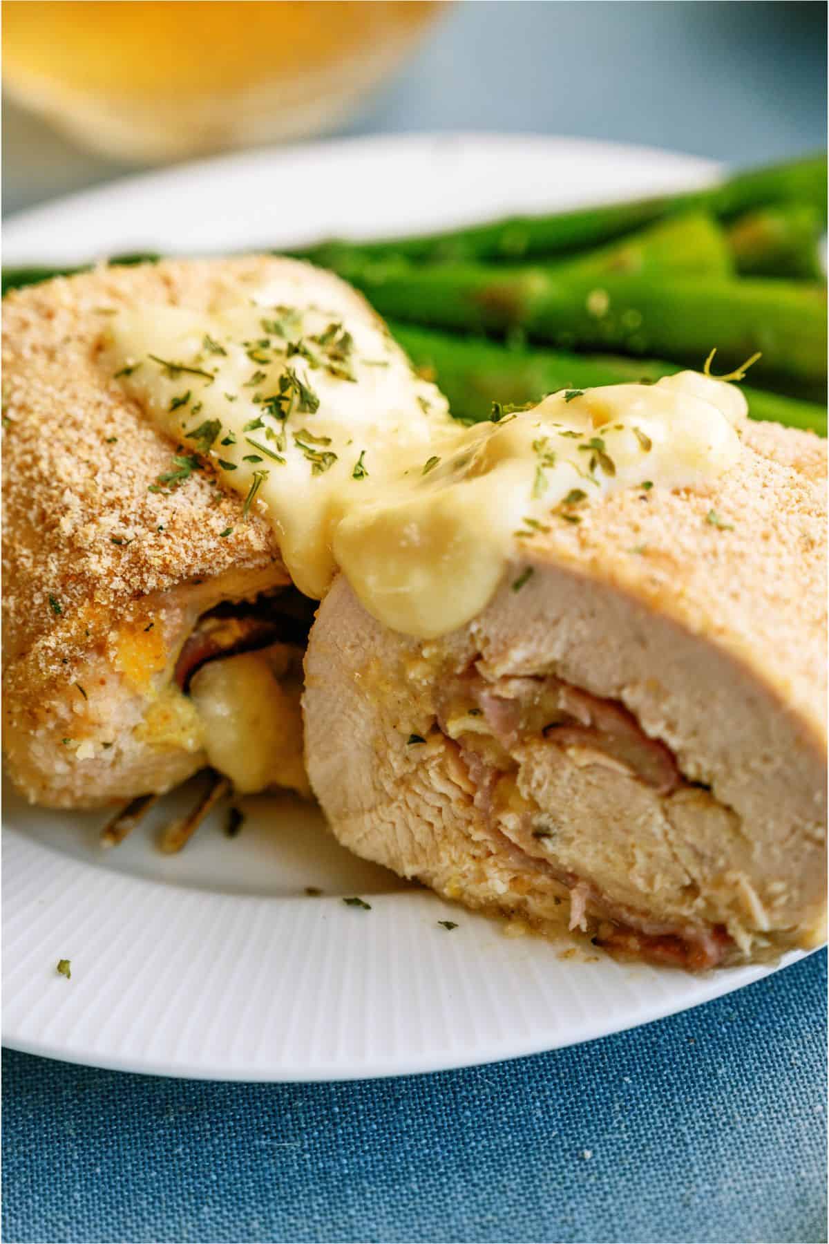 Malibu Stuffed Chicken sliced in half on a plate