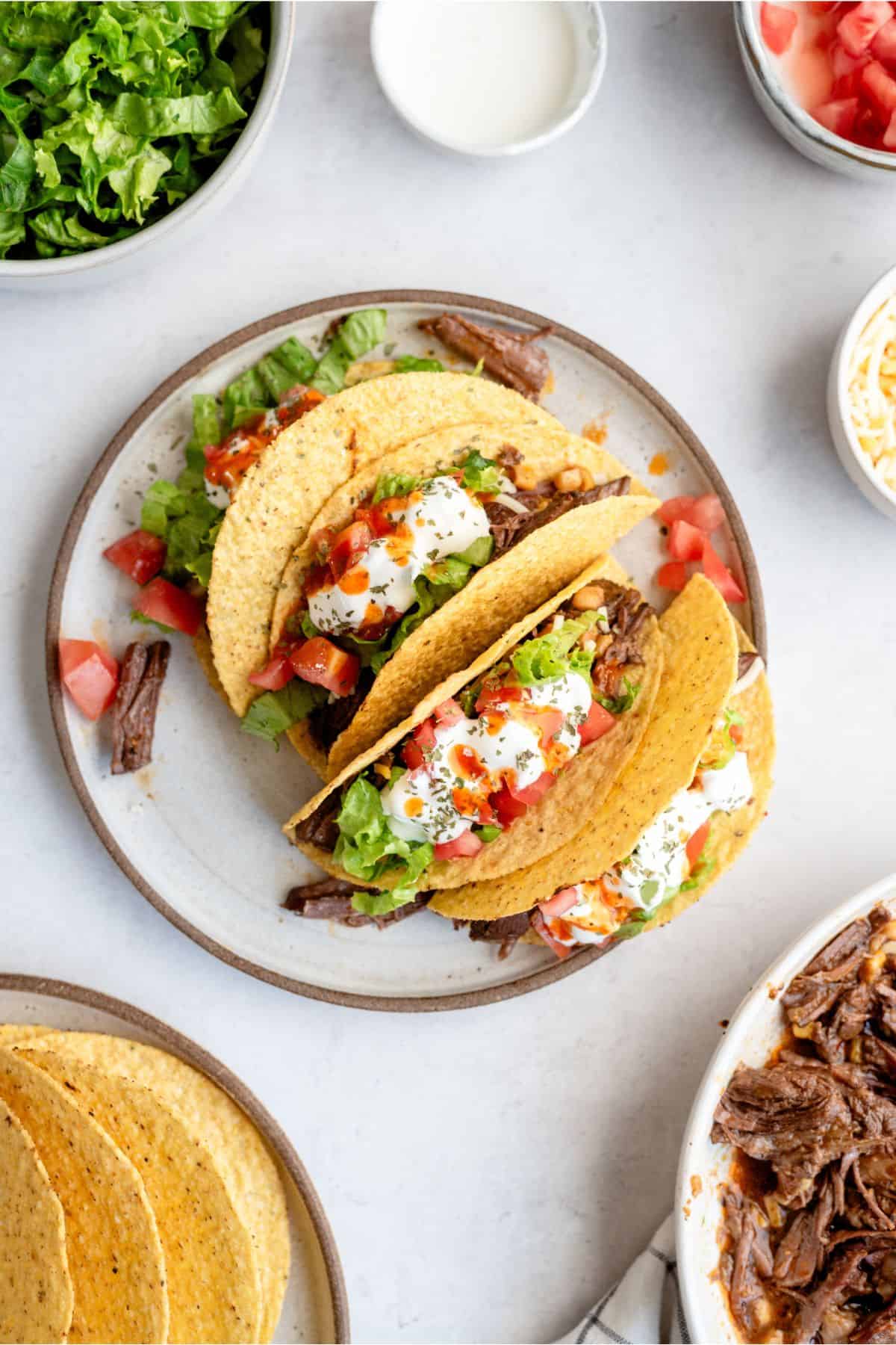 Top view of a plate of Slow Cooker Shredded Beef Tacos