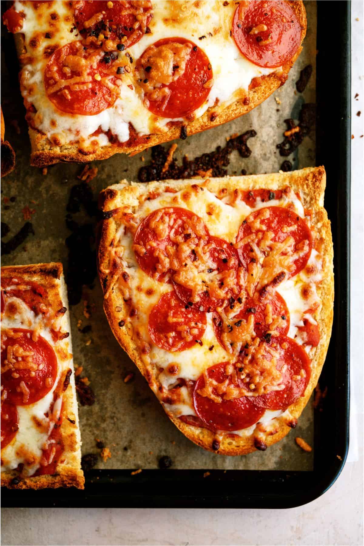 Air Fryer French Bread Pizza on a baking sheet