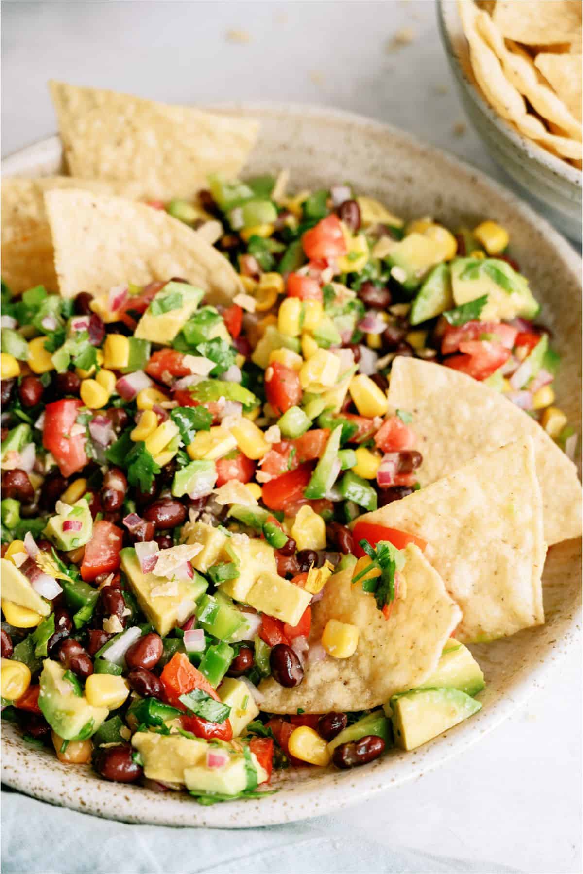 A bowl of Cowboy Caviar mixed with Tortilla chips
