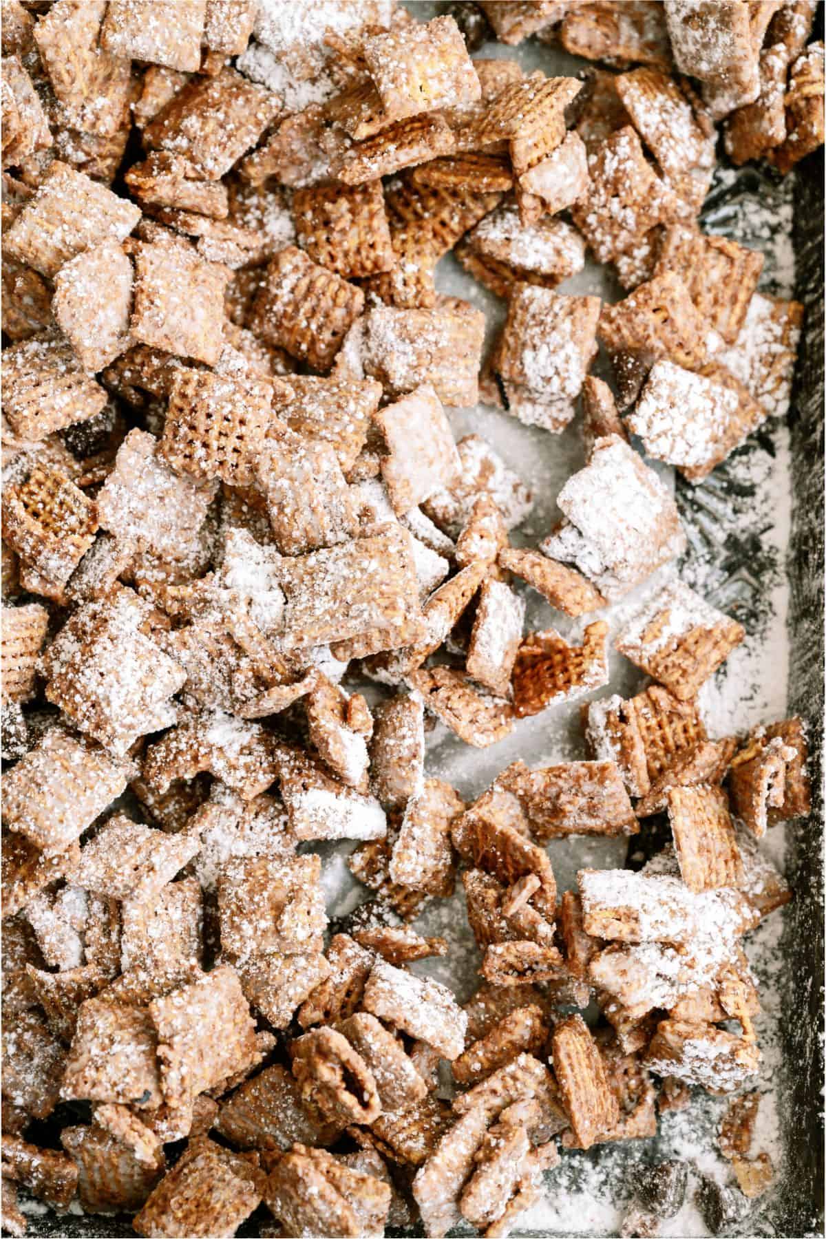 Close up of Muddy Buddies (Puppy Chow) on a baking sheet