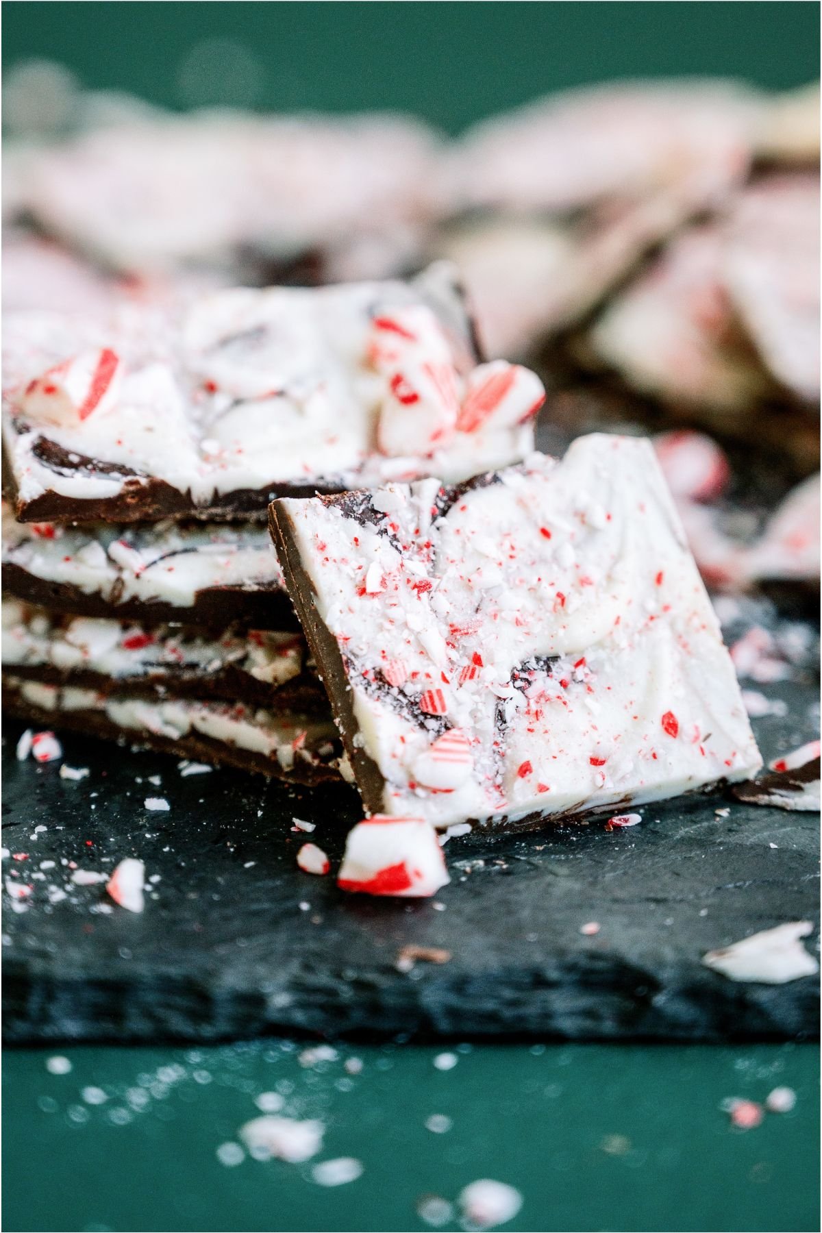 Pieces of Peppermint Bark stacked with one leaning against the stack.